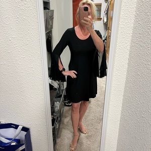 Black swing dress with flutter sleeves